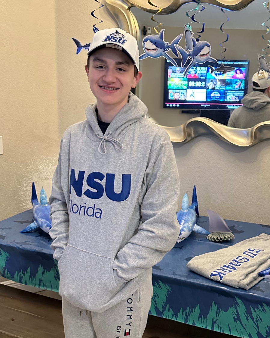 Portrait of Mason Katcher wearing an NSU cap and hoodie.